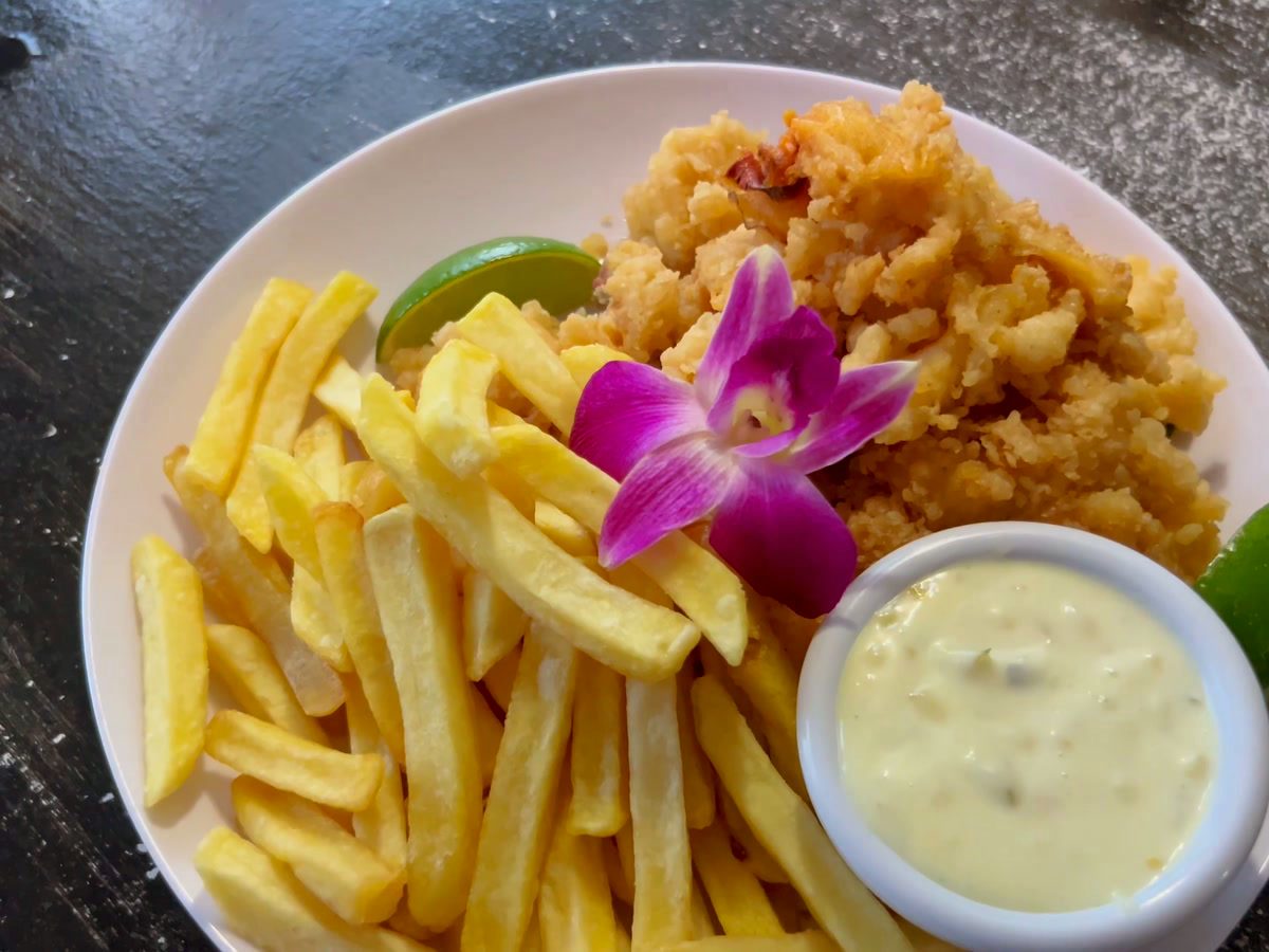 Golden fried cracked conch served with seasoned fries and house dipping sauce.