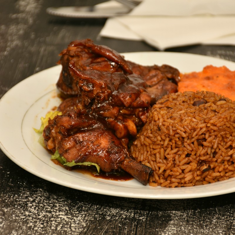 Char-grilled jerk chicken hot off the grill